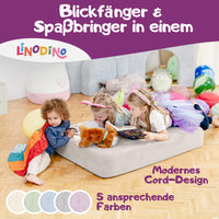 Spielmatte in Beige, genutzt als Hüpfpolster und Lesefläche für Kinder